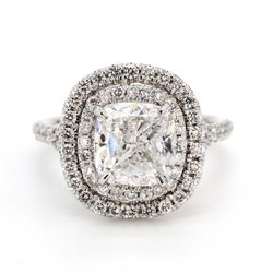 Double halo split-shank semi-mount with prong set round diamonds.  D0.86ct.t.w.