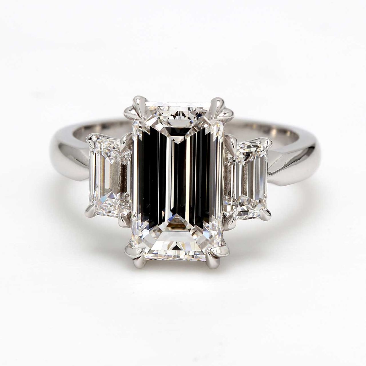 3-stone semi-mount in platinum with 4-prong set GIA certified D/VVS-VS2 emerald cut diamond sides.  D1.02ct.t.w.  Size 6.5