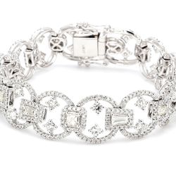 Designer halo bracelet in 18K WG with french pave set round diamond sides & prong set rounds and fancy shape diamond centers.  D7.48ct.t.w.