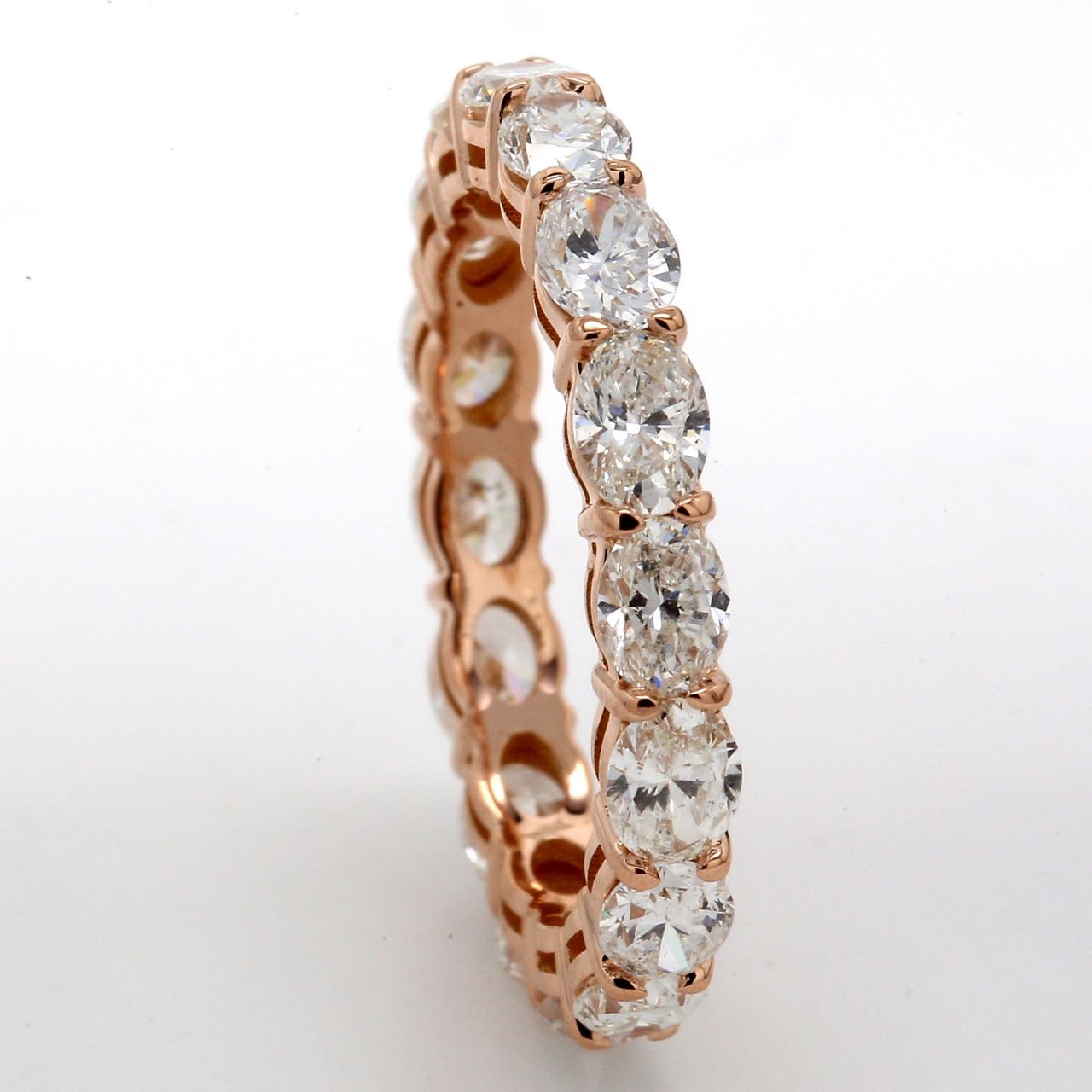 Eternity band east to west style in 18K RG with prong set (16) oval diamonds.  D3.04ct.t.w.  Size 7