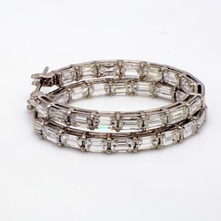 1' Inside out hoop earrings in 18K WG with prong set (32) emerald cut diamonds.  D6.04ct.t.w.