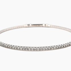 Flexible bangle in 18K WG with pre-set round diamond.  D1.01ct.t.w.