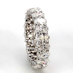 Eternity band with shared U-prong set E-F/VS+ (21) oval diamonds.  D3.26ct.t.w.  Size 5.5