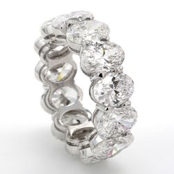 Eternity band in platinum with basket claw prong set GIA certified D-F/SI1 (13) oval diamonds.  D9.15ct.t.w.  Size 5