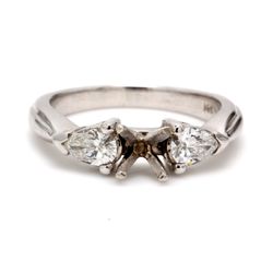 3-stone semi-mount with pear shape diamond sides.  D0.49ct.t.w.