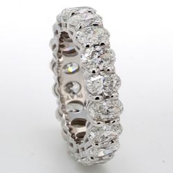 Eternity band in platinum with U-shaped basket set (18) oval diamonds.  D3.99ct.t.w.  Size 5.25