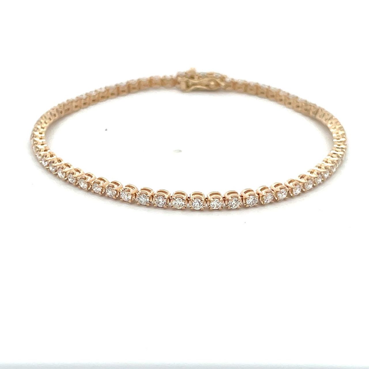 7' Tennis bracelet in yellow gold with illusion set (64) round diamonds.  D1.67ct.t.w.