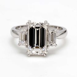 3-stone semi-mount in platinum with 4-prong set GIA certified D/VVS-VS2 emerald cut diamond sides.  D1.02ct.t.w.  Size 6.5