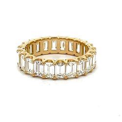 Eternity band in 18K YG with basket prong set (22) emerald cut diamonds.  D4.82ct.t.w.  Size 6.5