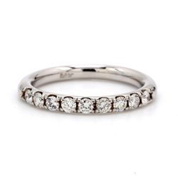 Comfort fit band with 4-prong set (9) round diamonds.  D0.44ct.t.w.  Size 6.5