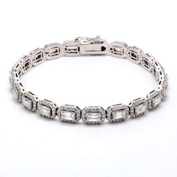 7' Halo bracelet east to west style with pave set rounds around (23) emerald diamond centerstones.  D7.12ct.t.w.