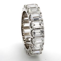 Eternity band in platinum with U-prong set (19) emerald cut diamonds.  D6.10ct.t.w.  Size 5