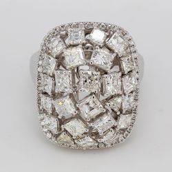 Halo fashion ring in 18K WG with french pave set rounds around prong set asscher, princess, radiant, & trilliant cut diamonds in the middle.  D3.95ct.t.w.