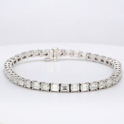 7' Tennis bracelet east to west style in platinum with prong set emerald cut diamonds.  D8.12ct.t.w.