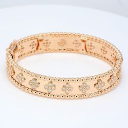 Flower bangle in 14K RG with bezel set (80) round diamonds.  D2.02ct.t.w.