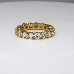 Eternity band in 18K YG with shared prong set (19) round diamonds.  D3.52ct.t.w.  Size 6.75