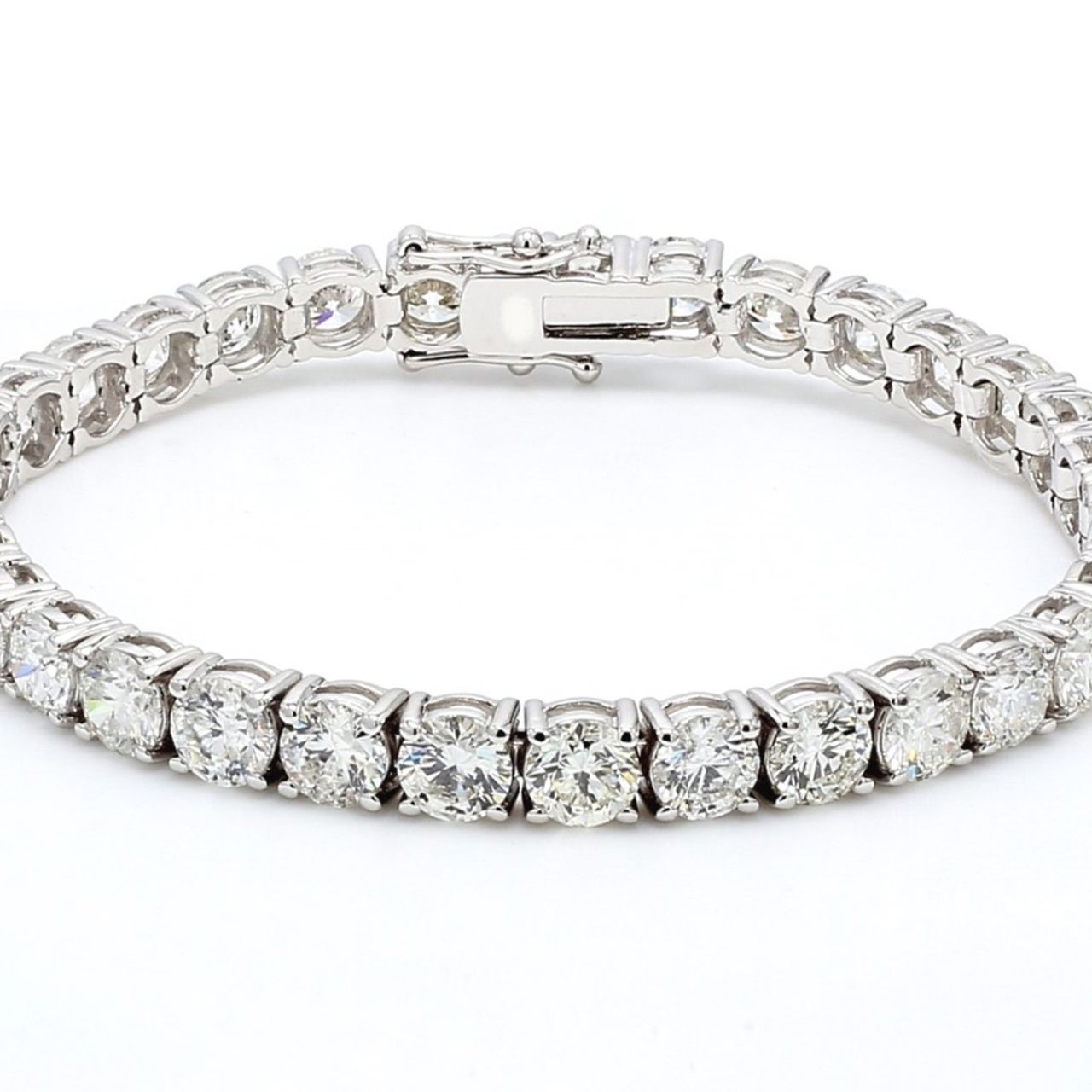 7' Tennis bracelet in 18K WG with 4-prong set (38) round diamonds.  D11.69ct.t.w.
