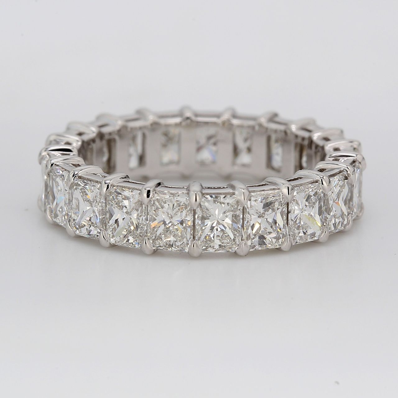 Eternity band in platinum with double basket shared prong set (21) radiant cut diamonds.  D5.48ct.t.w.  Size 7.25