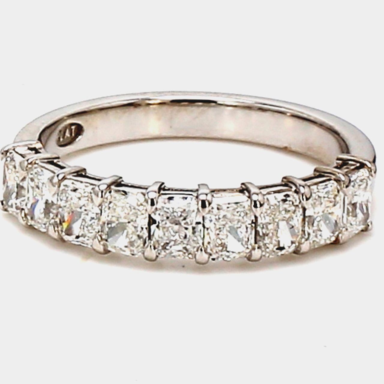 9-stone band in platinum with basket prong set radiant cut diamonds.  D1.31ct.t.w.  Size 5.75