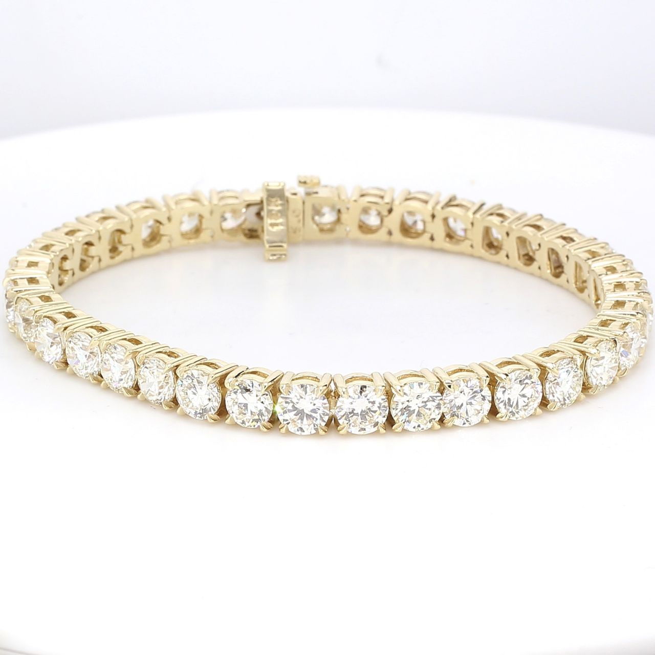 7' Tennis bracelet in 14K YG with 4-prong basket set round diamonds.  D10.69ct.t.w.
