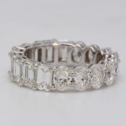 Eternity band in platinum with basket prong set VVS-VS oval & emerald cut diamonds.  D5.40ct.t.w.  Size 5.5