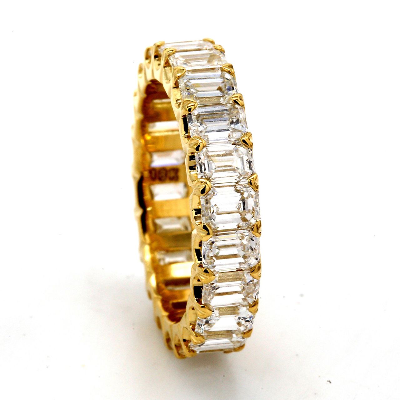 Eternity band in 18K YG with U-prong set (22) emerald cut diamonds.  D4.22ct.t.w.  Size 5.5