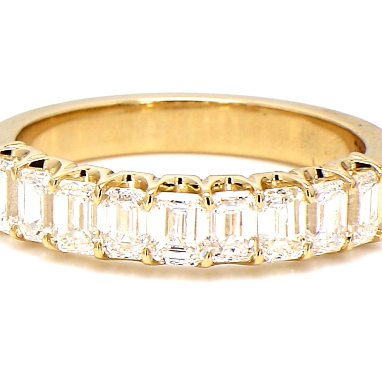 9-stone band in yellow gold with U-prong set emerald cut diamonds.  D2.16ct.t.w.