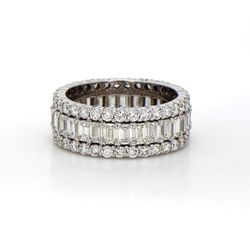 Eternity band in 18K WG with prong set emerald cuts on the center and round diamonds on each side.  D4.89ct.t.w.  Size 7