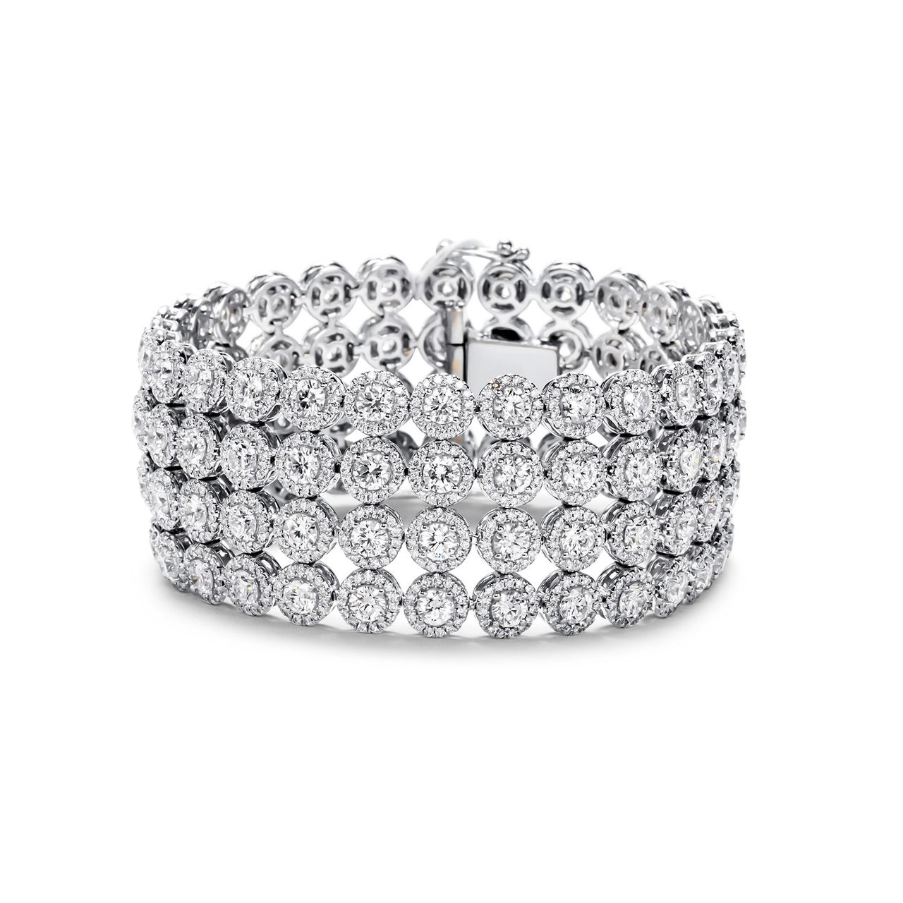 Halo 4-row bracelet in 18K WG with French pave set rounds around prong set round diamond center stones.  D26.92ct.t.w.