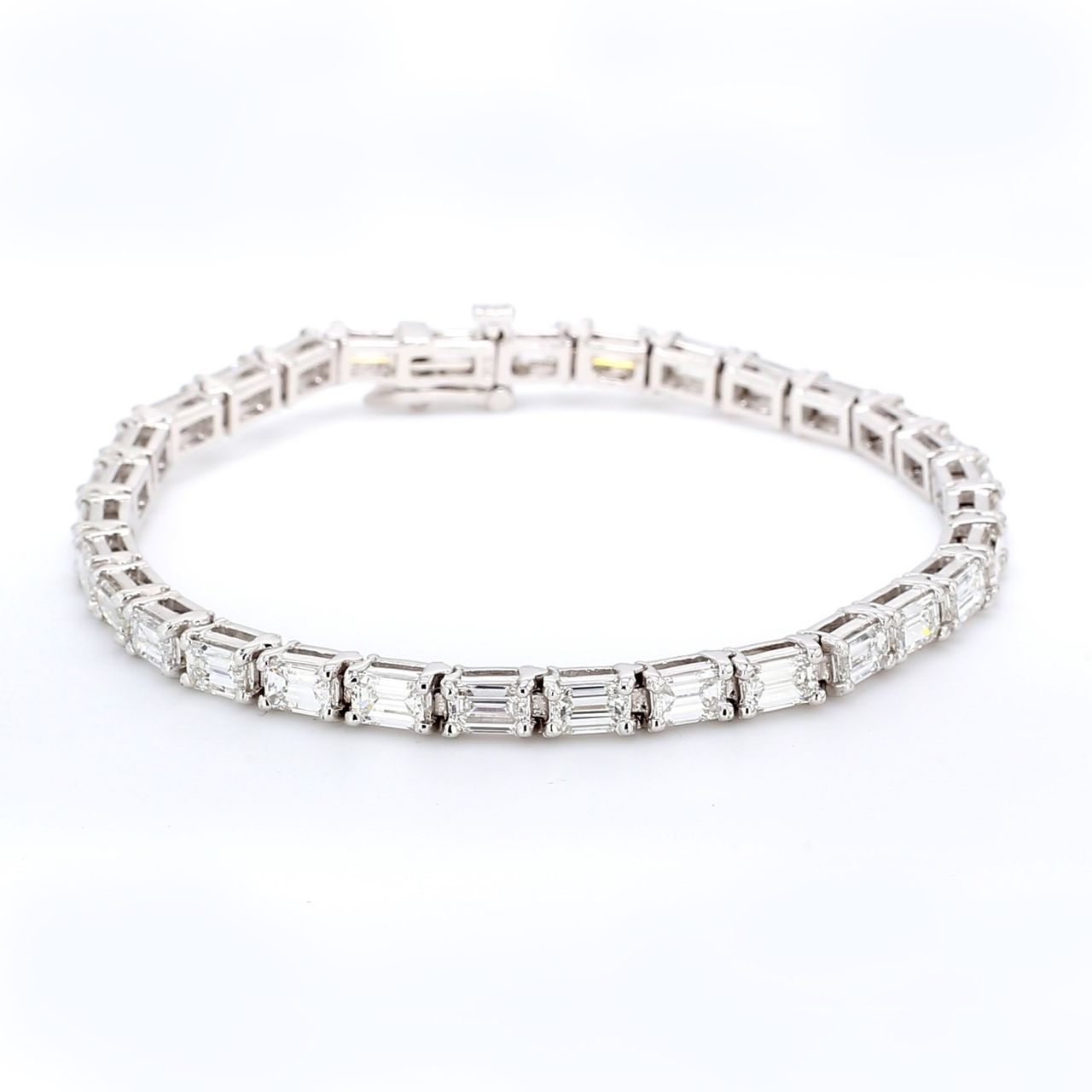 7' East to west style tennis bracelet with 4-prong set (31) emerald cut diamonds.  D8.24ct.t.w.