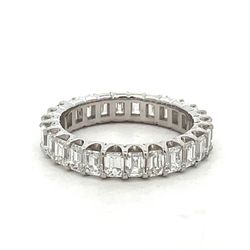 Eternity band in platinum with prong set (26) emerald cut diamonds.  D3.38ct.t.w.  Size 6