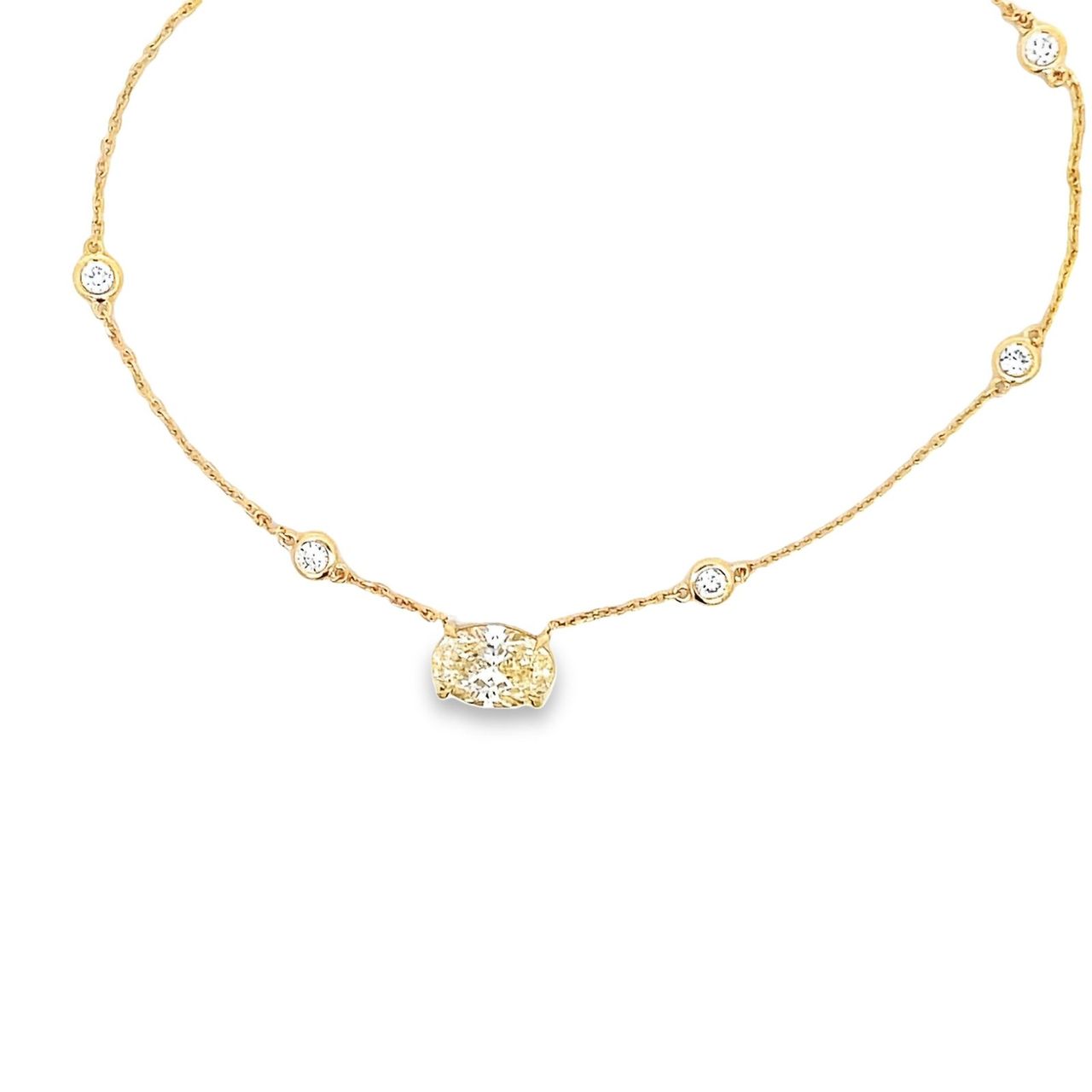 16' Diamonds by the yard necklace in 14K YG with bezel set (10) rounds and 4-prong set GIA certified M/SI2 oval diamond center.  D3.40ct.t.w.  (Center - 2.52ct.)