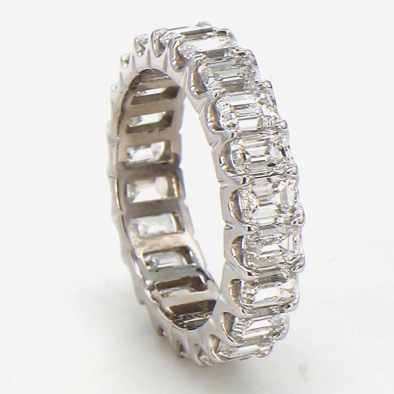Eternity band in platinum with U-prong set (22) emerald cut diamonds.  D4.21ct.t.w.  Size 5