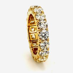 Eternity band in 18K YG with prong set (17) round diamonds.  D4.14ct.t.w.  Size 6