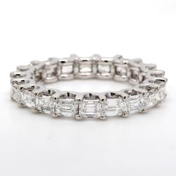 East to west style eternity band with U-prong set (21) emerald cut diamonds.  D1.98ct.t.w.  Size 6