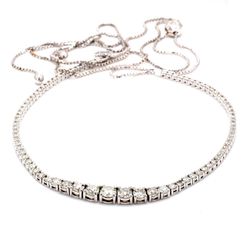 Bolo style adjustable graduated tennis necklace with 4-prong set (85) round diamonds.  D5.29ct.t.w.