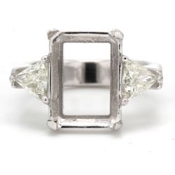 3-stone semi-mount with eagle claw prong setting for center and trilliant diamond sides.  D1.02ct.t.w.  Size 9