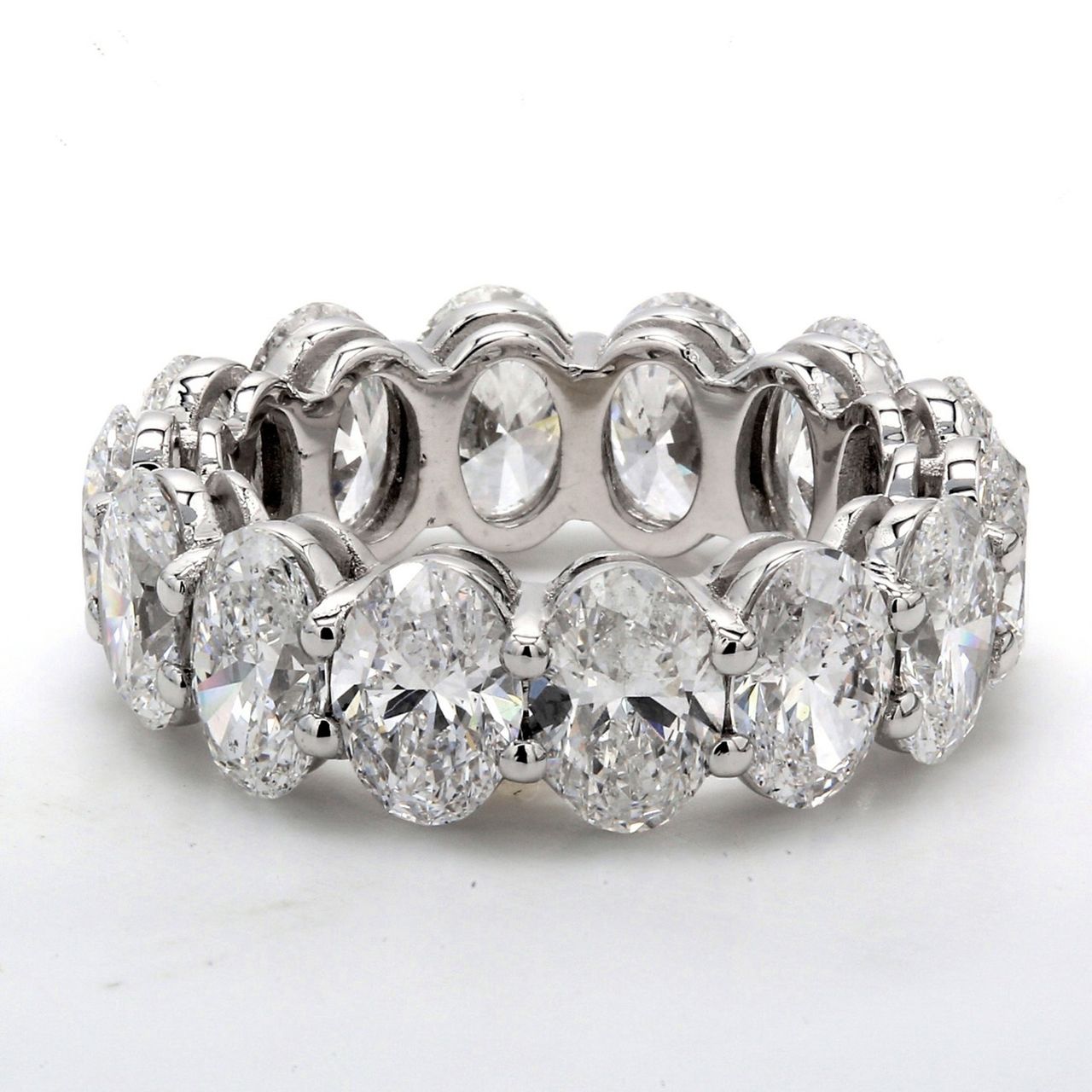 Eternity band in platinum with shared prong basket set GIA certified D-F/SI1-2 (14) oval diamonds.  D9.88ct.t.w.  Size 6.75
