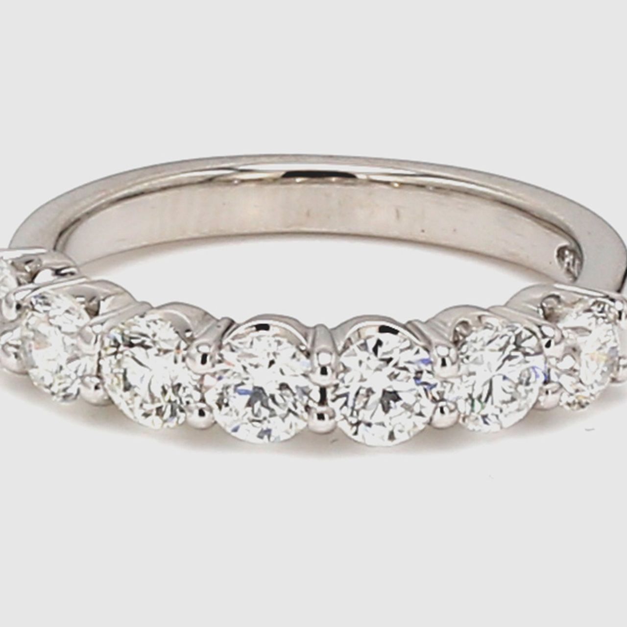 7-stone band in platinum with prong set round diamonds.  D1.28ct.t.w.  Size 6