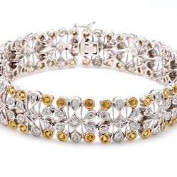 Art deco style bracelet in 18K two-tone with round diamonds & yellow sapphires.  D1.36ct.t.w.  Yellow Sapphires 0.99ct.t.w.