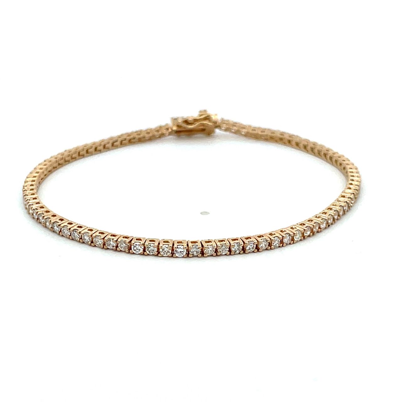 7' Tennis bracelet in yellow gold with 4-prong set round diamonds.  D1.88ct.t.w.