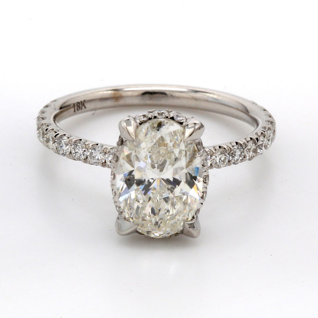 Semi-mount for oval center in 18K WG with pave set (54) round diamonds.  D0.95ct.t.w.  Size 6