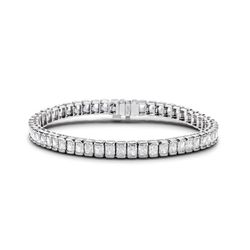 7' Tennis bracelet in platinum with half bezel set (54) radiant cut diamonds.  D12.92ct.t.w.