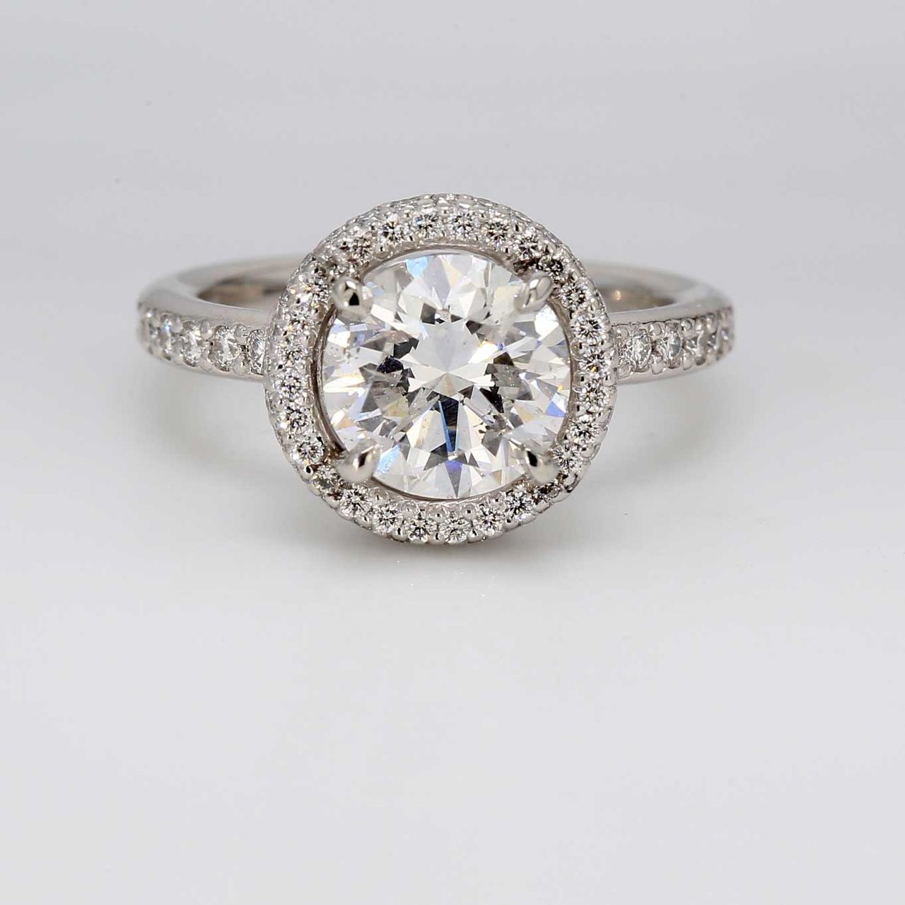 Halo semi-mount in platinum with round diamonds.  D1.00ct.t.w.