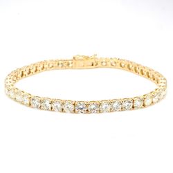 7.25' Tennis bracelet in yellow gold with 4-prong set (42) round diamonds.  D12.78ct.t.w.