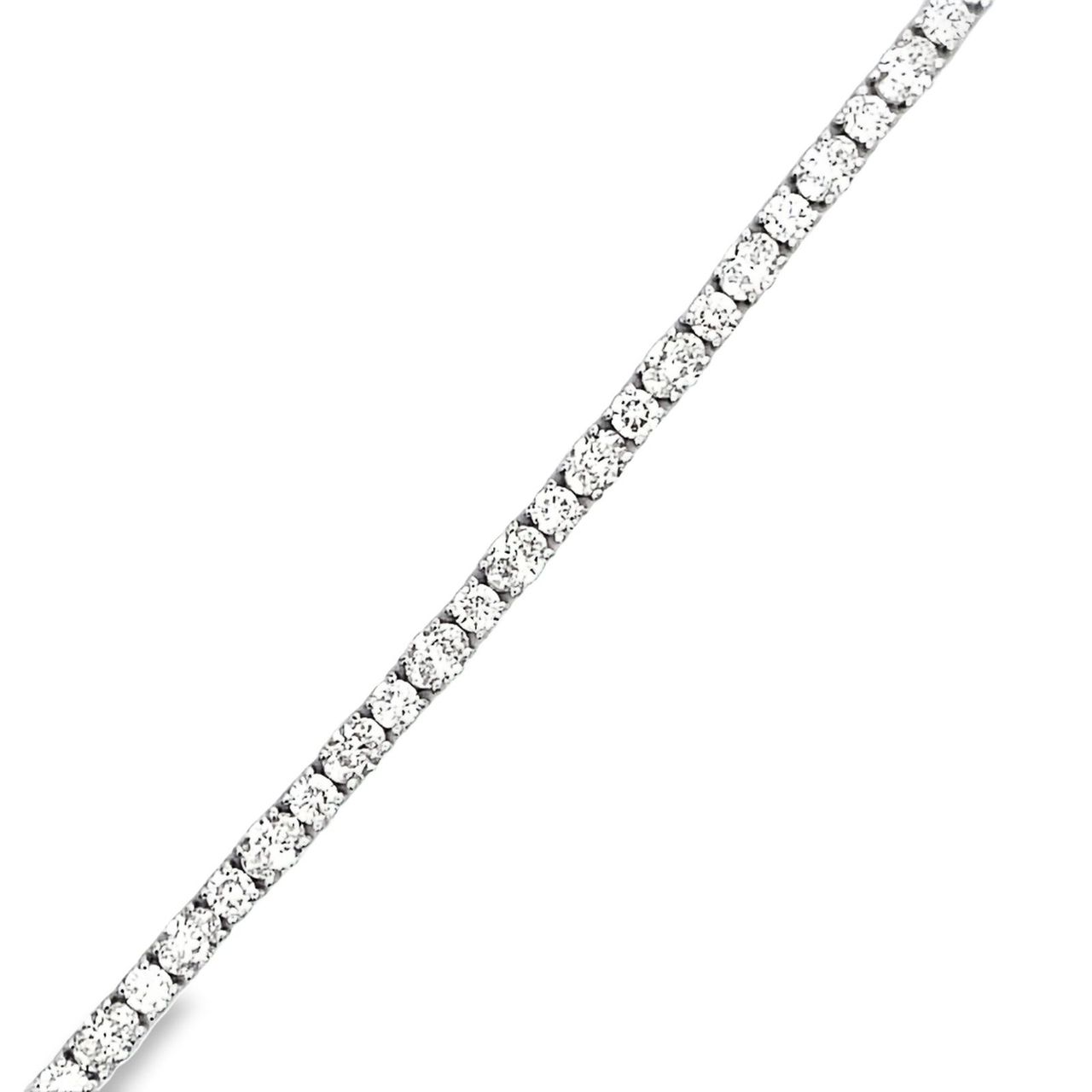 7' Tennis bracelet in 18K WG with basket prong set mixed round and oval diamonds.  D7.47ct.t.w.