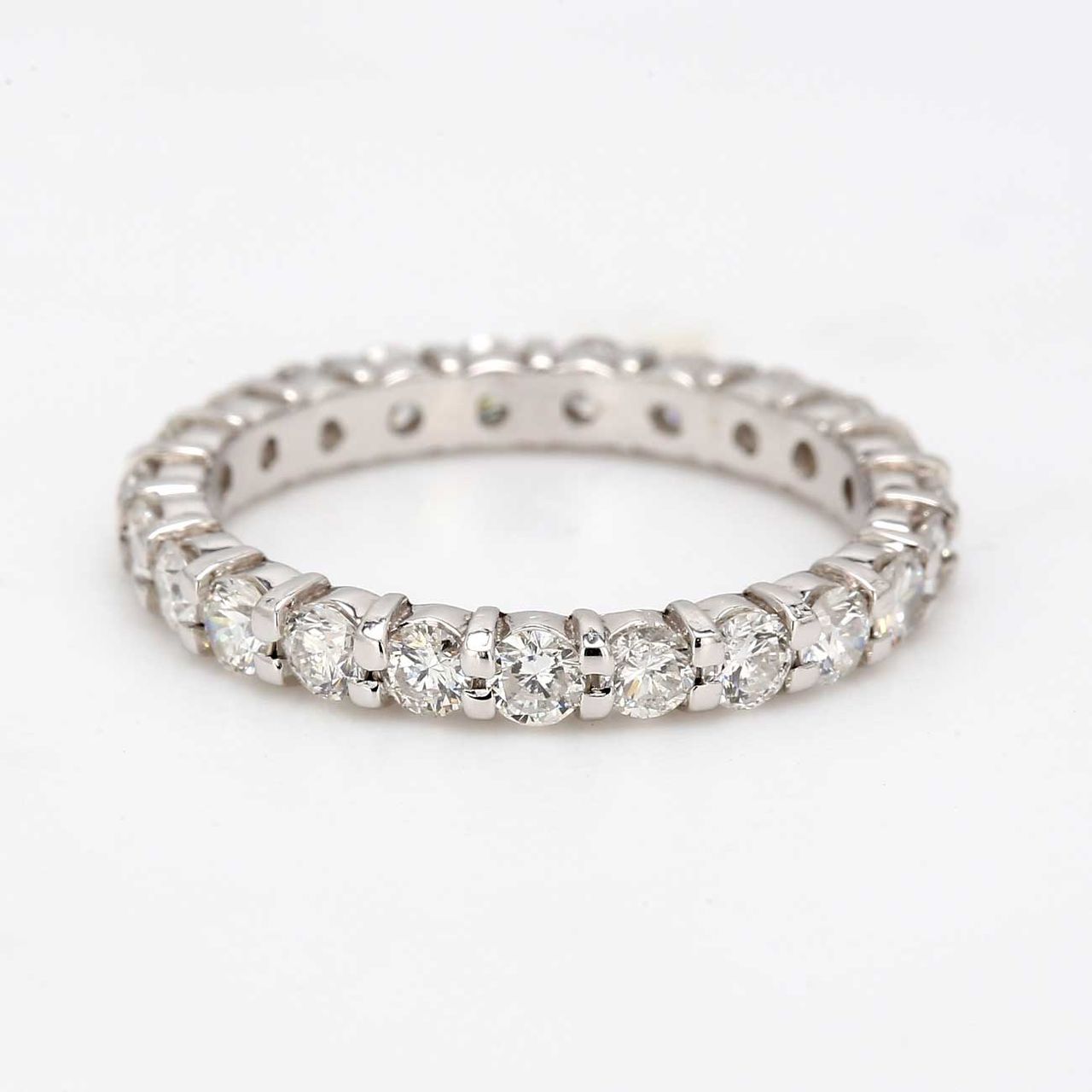 Eternity band with shared prong set (23) round diamonds.  D1.53ct.t.w.  Size 6.75