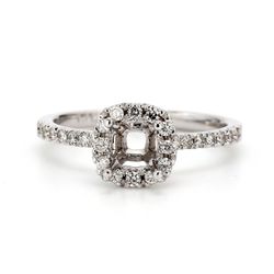 Halo semi-mount with pre-set round diamonds.  D0.30ct.t.w.  Size 6.25