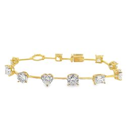 7' Bar style bracelet in 18K YG with basket prong set (12) multi-shape diamonds.  D12.68ct.t.w.
