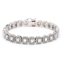 7' Designer halo bracelet in 18K WG with shared prong set rounds & 4-prong set emerald cut diamonds.  D9.26ct.t.w.